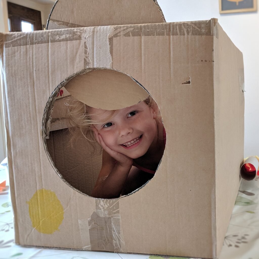 dramatic play cardboard box spaceship rocket